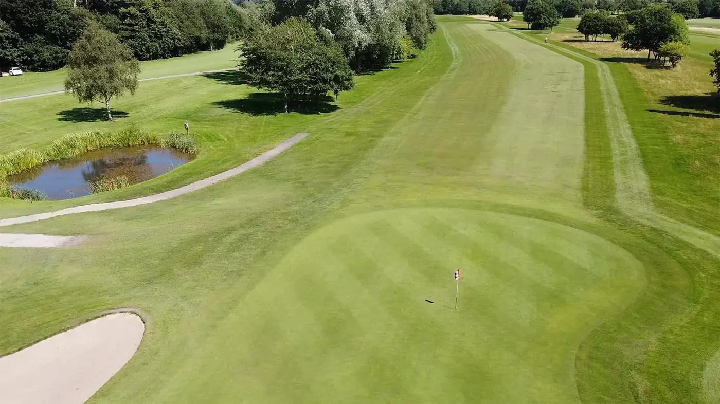 Wide fairway with water hazard