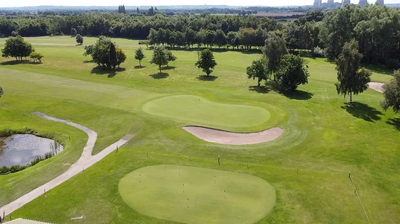 Aerial view of a green surrounded by bunkers